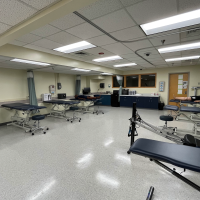 The Clinic Room has high-low tables, hospital curtains, and healthcare equipment. 