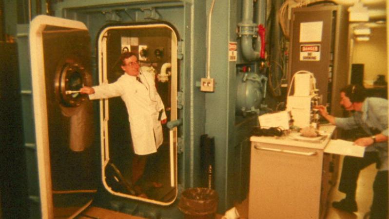 Man stepping out of a hypo-hyperbaric chamber