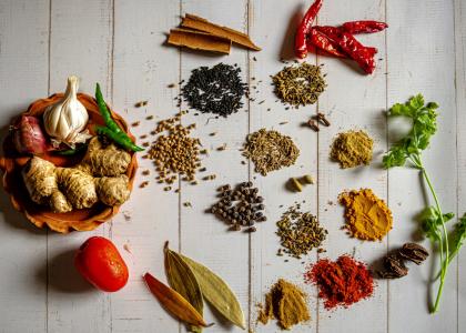 A variety of herbs and spices laid out on a table