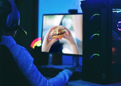 hamburger displayed on the monitor of a computer in a dark room
