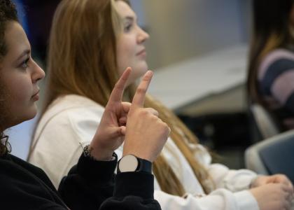 Students practice sign language in class