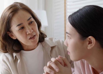 Mom having serious conversation with teen daughter