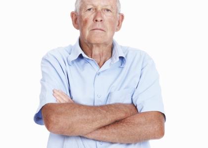 elderly man with arms crossed