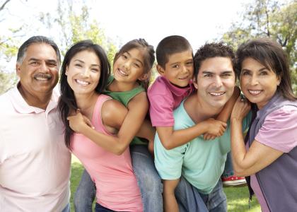 Several people of Hispanic/Latino decent who appear to be 3 generations of a family