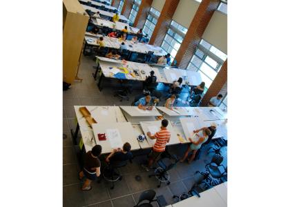Penn State architecture camp students at drawing boards 