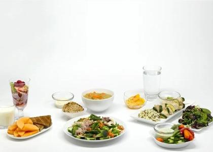 a variety of healthy foods on white plates