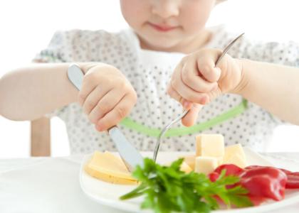 Child eating fruits and vegetables