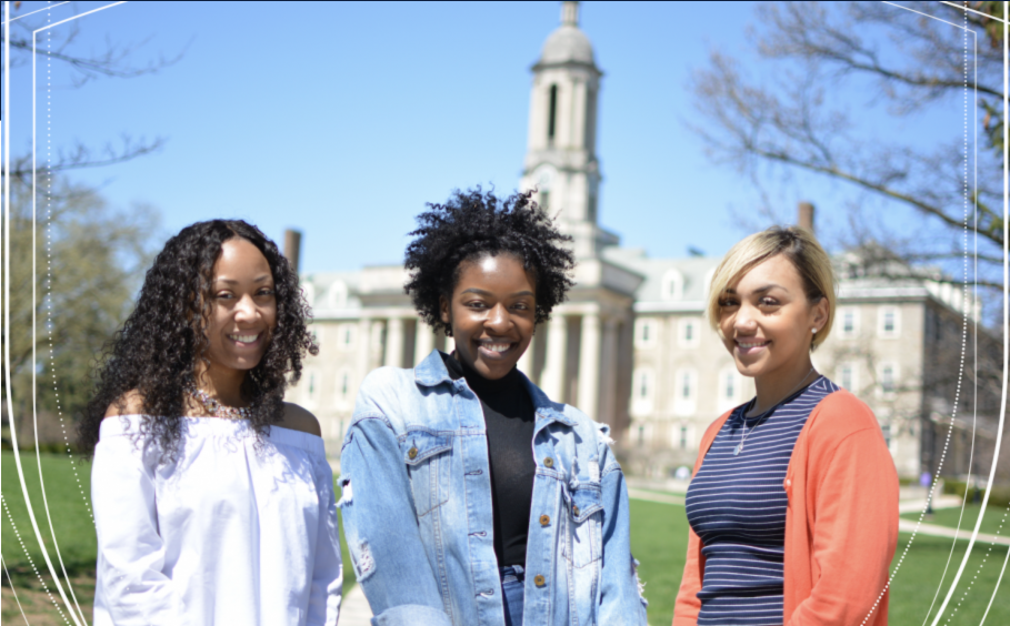 3 women standing in front of old main