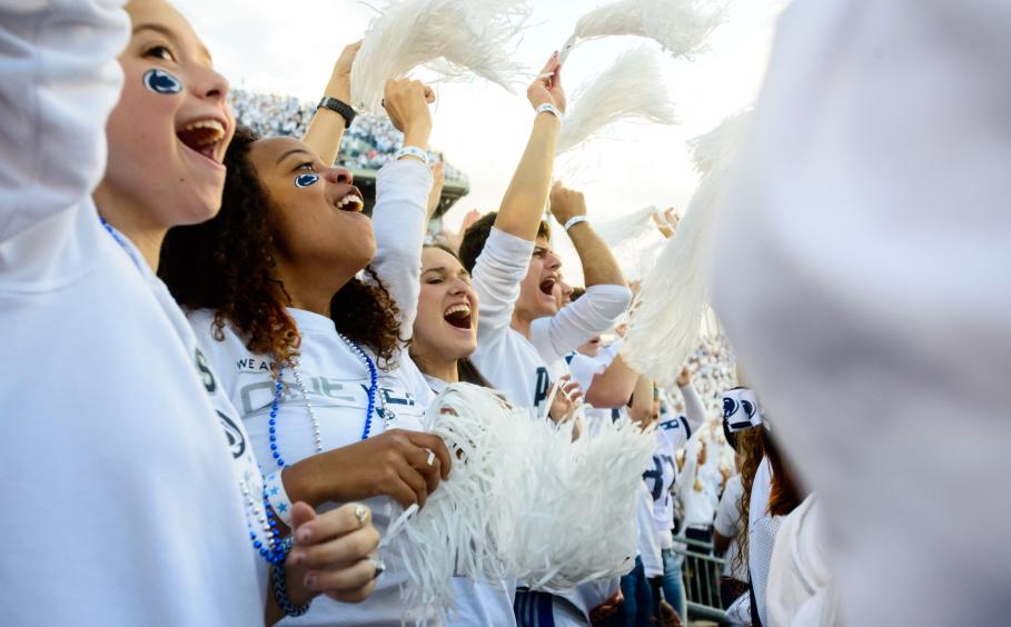 Students at a white out at Beaver Stadium.