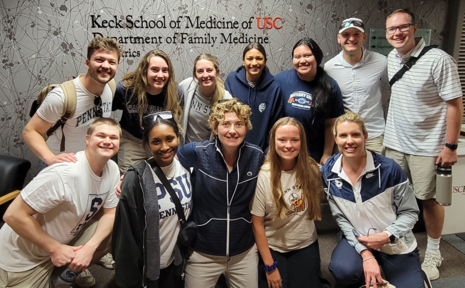 Students and mentors who participated in the Street Medicine Initiative pose in front of a wall displaying "Keck School of Medicine of USC, Department of Family Medicine."