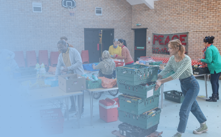 Several people are working in a food distribution center organizing food for those in need.