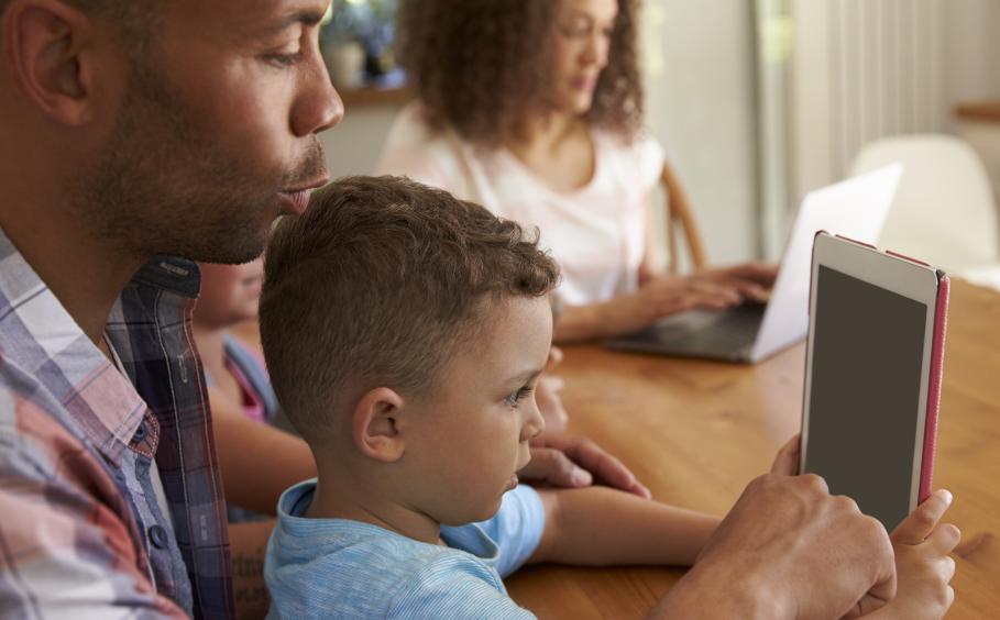 Father and son using a tablet device. 