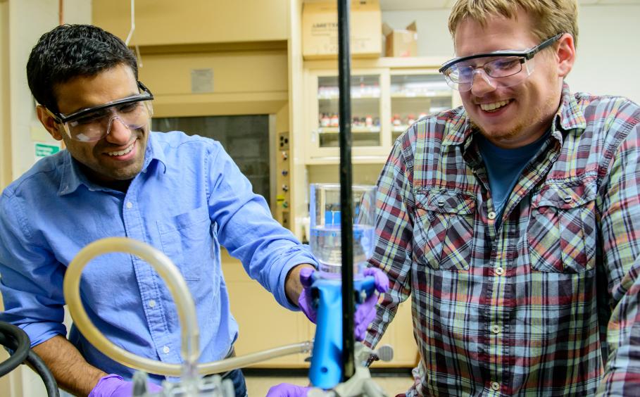 Students conducting research in a laboratory. 