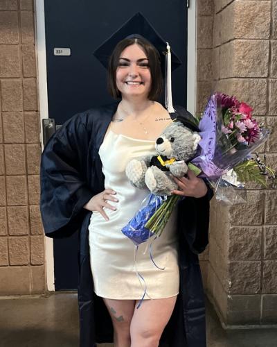 Madeline Torquato in her cap and gown at graduation