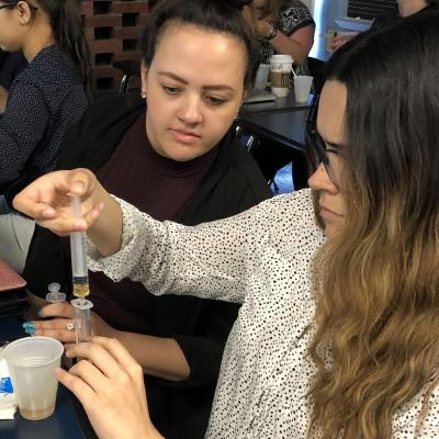 Students mix liquids during a dysphagia lab
