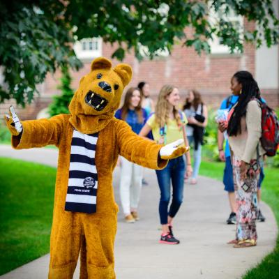 Nittany lion mascot welcoming with open arms. 