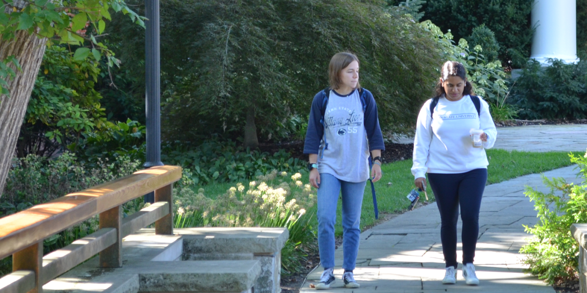 Students walking together at the Alumni Center