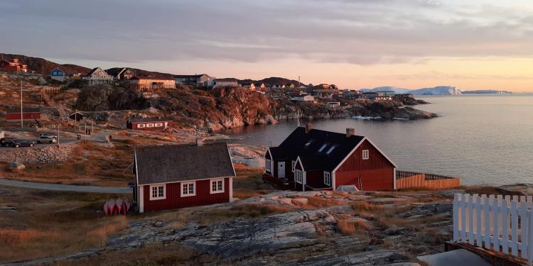 coastal Greenland village at sunset