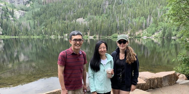Three Penn State RPTM faculty and students in front of a lake at Rocky Mountain National Park