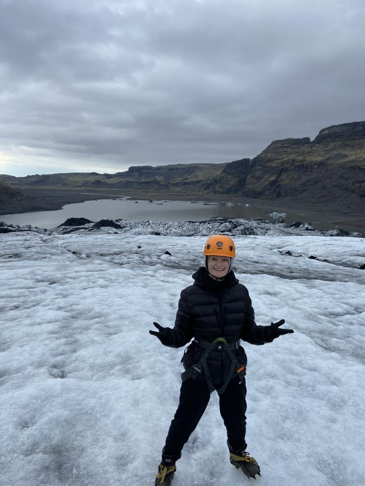 Elena standing on a glacier and smiling